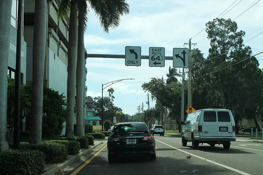 Overhead sign for State Road 64 East in downtown Bradenton