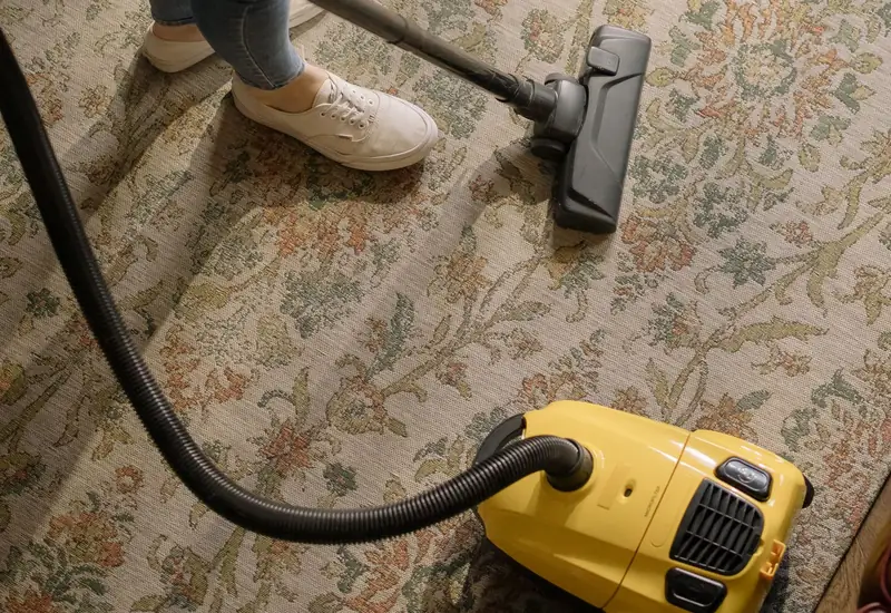 Vacuuming a patterned carpet with a canister vacuum